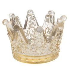 a clear glass crown sitting on top of a table