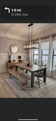 a dining room table with chairs and a bench