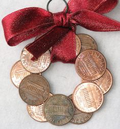 a red ribbon is tied around some coins