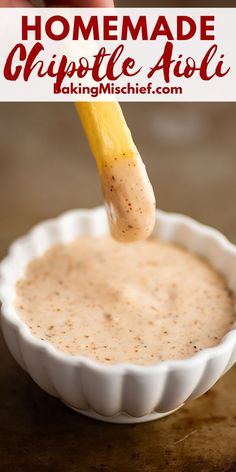 homemade chipotle aioli being dipped with a wooden stick