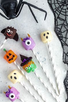 halloween cake pops with candy faces on them