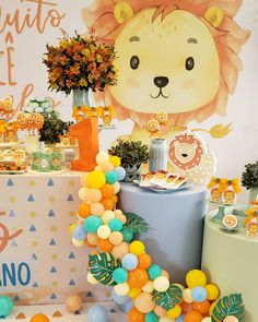 a lion themed birthday party with balloons and decorations