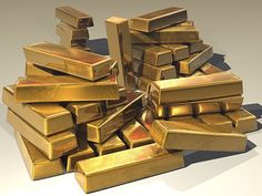 a pile of gold bars sitting on top of each other