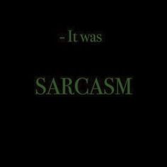 the words sarcasm are lit up against a black background with green writing on it