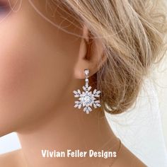 Snowflake Earrings Winter Wedding Bridal Jewelry Cubic Zirconia Sparkly Charming And Sparkle Like Diamonds! These Earrings Feature Tons Of Sparkling Clear Cubic Zirconia Stones Forming Together Given A Snowflake Like Design. Set In Beautiful Rhodium (White Gold) Finish Over Brass. They Sparkle Amazingly ! Perfect For A Winter Wedding Or Special Occasion ! Earrings Posts Are Sterling Silver. The Components Are High Quality Luster Rhodium Plated Over Brass - Tarnish Resistant, Lead Free, Nickel Fr Christmas Wedding Jewelry, Elegant Christmas Anniversary Earrings, Wedding Diamond Jewelry With Snowflake Design, Snowflake Cubic Zirconia Jewelry For Anniversary, Elegant Snowflake Shaped Cubic Zirconia Jewelry, Cubic Zirconia Snowflake Jewelry For Anniversary, Sparkling Christmas Wedding Jewelry, Anniversary Snowflake Cubic Zirconia Jewelry, White Gold Jewelry For Christmas Wedding