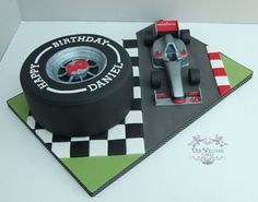 a birthday cake with a racing car on it