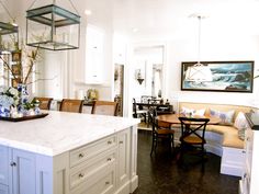 a large kitchen with an island in the middle and lots of counter space on one side