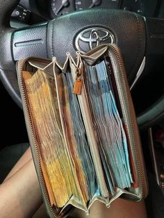 the interior of a car with colorful papers in it