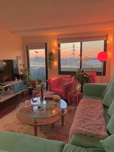 a living room filled with furniture and a flat screen tv