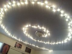 the lights are hanging from the ceiling in the room