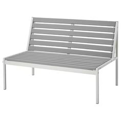 a white bench with grey slats on it