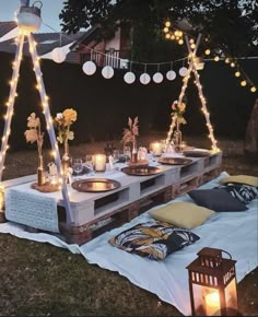 an outdoor party setting with lights and decorations