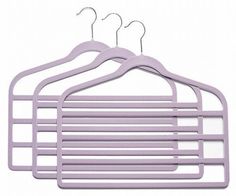 three pink hangers on a white background