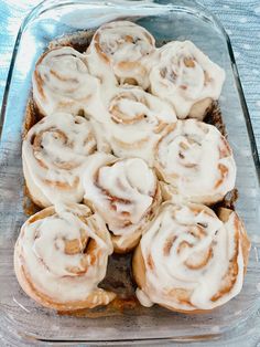 a glass baking dish filled with cinnamon rolls