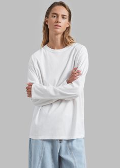 Color: Ivory Lightweight cotton fabric Relaxed fit Crew neckline Drop shoulders Long sleeves Slip on style Unlined 100% Cotton Machine Wash Cold By The Frankie Shop. Imported The Frankie Shop, Frankie Shop, Color Ivory, White Long Sleeve, Drop Shoulder, Crew Neckline, Long Sleeve Tees, Cotton Fabric, Slip On