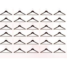 a bunch of black clothes hangers on a white background