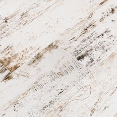 an old white wood floor with peeling paint