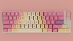 a pink and yellow keyboard on a pink background