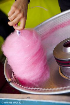 a pink ball of yarn next to a blender