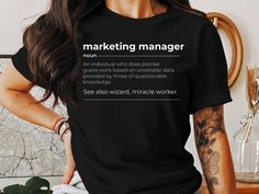 This Marketing Manager T-Shirt, Gift for Marketing Manager, Gift for Marketing Director, Marketing Director, Gift for Marketer, Definition Shirt is everything you've dreamed of and more. Makes an excellent gift for any Marketing Manager! If you love super soft, lightweight, extremely comfy t-shirts, sweatshirts, or hoodies then you will love this product! My t-shirts, sweatshirts and hoodies are printed with a professional printer for a soft, durable, long lasting, printed graphic using high qua Marketing Manager Outfit, Definition Shirt, Company Shirts, Marketing Director, Sweat Shirts, Marketing Professional, Sweatshirts And Hoodies, Marketing Manager, Boho Gifts