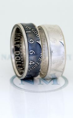 NashvilleMint High Quality Coin Rings $1 Silver Dollar Coin Rings: http://etsy.me/2jtdMKZ 50¢ Silver Half Dollar Coin Rings: http://etsy.me/2jDqk57 25¢ Silver Quarter Coin Rings: http://etsy.me/2jRdhdz Silver Coin Ring Pendants: http://etsy.me/3DnUS1N Silver Coin Ring Cufflinks: http://etsy.me/3OpVtWU Silver Coin Ring Earrings: http://etsy.me/46ZbDxJ This 1964 Double Sided Silver Coin Ring was handmade from a 90% Silver US Kennedy Half Dollar Coin, minted in 1964.  It's available in sizes 6 to 1 Black Ring Box, 55th Birthday Gifts, Silver Coin Ring, Coin Rings, Silver Dollar Coin, Silver Quarters, Custom Coins, Half Dollar Coin, Unique Bands