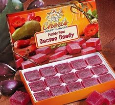 an open box of diced candy sitting on top of a table next to other food