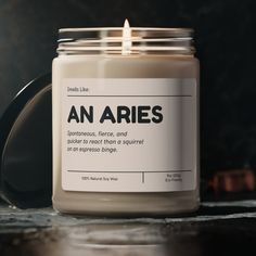 an aries candle sitting on top of a table