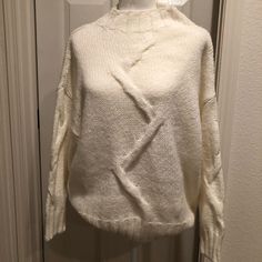 White Mock Neck Sweater. Faint Detail On Front Of Sweater And The Sleeves. Pairs Well With Nice Pair Of Jeans. Stay Warm With This Pretty Soft Sweater. Size M. Nwt White Mock Neck, White Cable Knit Sweater, Soft Sweater, Mock Neck Sweater, Softest Sweater, Cable Knit Sweater, White Sweaters, Charlotte Russe, Neck Sweater