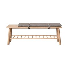 a wooden bench with a cushion on it