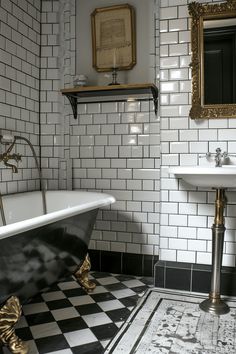 a black and white tiled bathroom with an antique claw foot bathtub in the corner