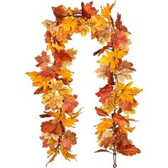 an autumn leaf garland hanging on a white wall in the shape of a letter n