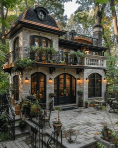 this is an image of a house in the middle of some trees and plants on the front porch