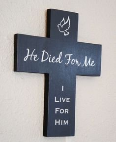 a wooden cross that says he died for me i live for him with a dove on it