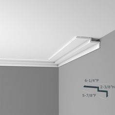 the corner of a room with a ceiling light and measurements for the height of the wall