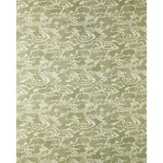 a green rug with white designs on it