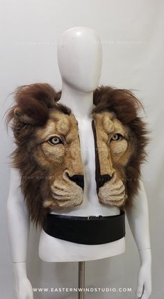 a mannequin with a lion head on it's chest and two ears