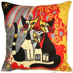 a decorative pillow with two cats on it