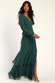 A refined beauty like you deserves a dress to match and the Lulus Tier Elegance Hunter Green Long Sleeve Tiered Maxi Dress is the perfect pick! Lightweight woven chiffon shapes this gorgeous dress that has a V-neckline framed by sheer long sleeves (with elastic at the cuffs). A set-in waist, with a tying sash belt, tops a stunning tiered maxi skirt with an alluring side slit. Hidden back zipper/clasp. Fit: This garment fits true to size. Length: Floor length. Size medium measures 62.25" from sho Long Forest Green Dress, One Sleeve Bridesmaid Dress, Long Sleeve Wedding Dress Guest, Green Winter Bridesmaid Dresses, Long Sleeve Maxi Dress Wedding Guest, Family Photos Green Dress, Fall Engagement Party Outfit Guest, Long Sleeve Sage Green Bridesmaid Dress, Holiday Green Long Sleeve Maxi Dress