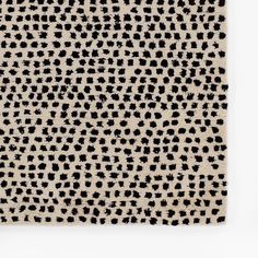 a black and white animal print rug on a wall