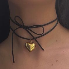 "The Keke Suede String Heart Necklace 🤍 *all photos owned by me!* Featuring a stainless steel puffy heart pendant, and a 48\" cut suede string cord. There are a ton of ways to wear this necklace (you can even wear it as a waist belt!) and if you need a custom length, DM me!  Choose between gold and silver at checkout  Unisex & tarnish proof 🖤 Made with love 🫶" Cute Black Necklace For Valentine's Day, Cute Black Heart-shaped Necklaces, Cute Black Heart Necklace, Cute Black Heart-shaped Necklace, String Heart, Gold Heart Choker, Suede Cord Necklace, Necklace String, Puffy Heart Necklace