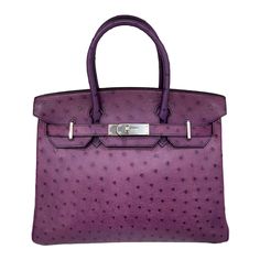 Hermes handbag, Birkin model, size 30, made of purple ostrich leather with silver hardware. Equipped with double leather handle and the classic flap closure with interlocking. Internally lined in smooth purple leather, very roomy. Full set, complete with padlock and keys. It is in like new condition. Purple Birkin, Hermes Birkin Ostrich, Ostrich Birkin, Ostrich Bag, Birkin 30, Purple Bag, Hermes Birkin 30, Togo Leather, Jane Birkin