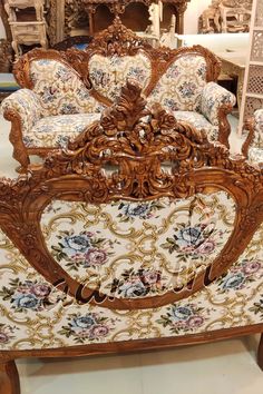 an ornately decorated couch in a store