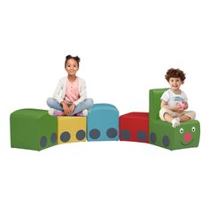 two children sitting on colorful blocks in front of each other