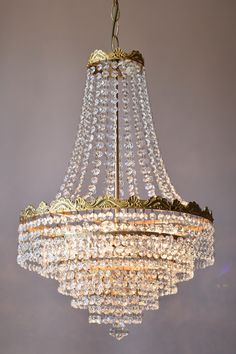 a chandelier hanging from the ceiling in a room