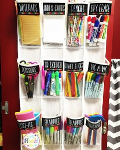 an organized closet with pens, pencils, markers and other office supplies on it