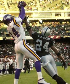 two football players in the air during a game