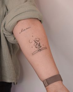 a woman's arm with a tattoo on it that reads, i love you