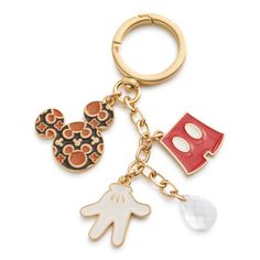 the mickey mouse and minnie mouse keychain is shown