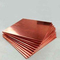 several pieces of copper are stacked on top of each other