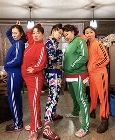 the girls are posing together in matching tracksuits